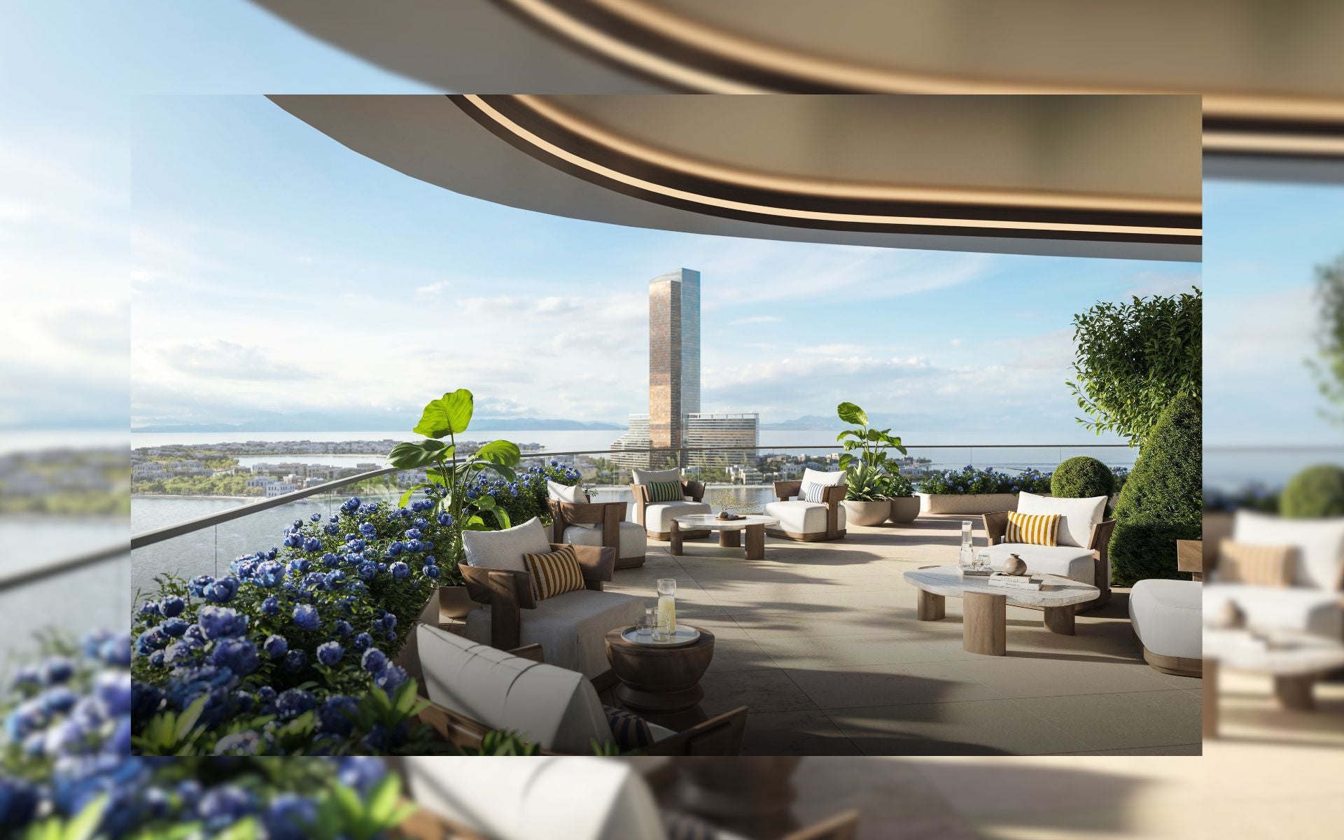 Modern rooftop terrace with lounge chairs, tables, and scenic Wynn Casino Resort view.