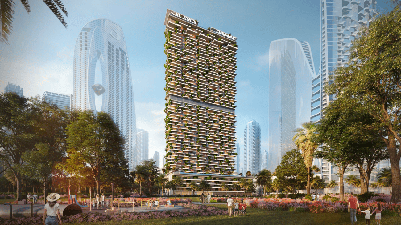 Modern cityscape with a prominent green-skinned building, surrounded by trees and people.