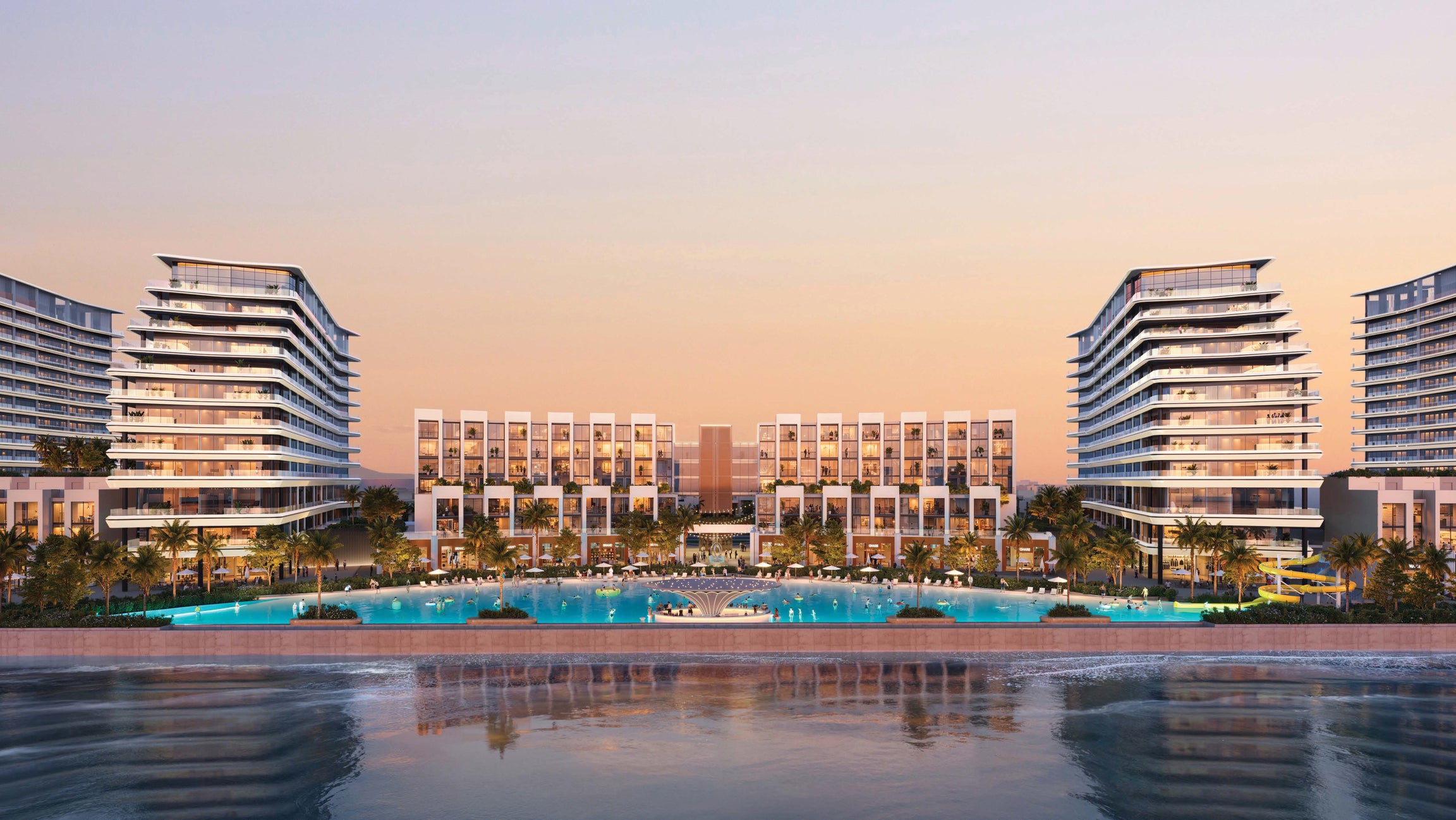 Modern architectural buildings by a waterfront at sunset