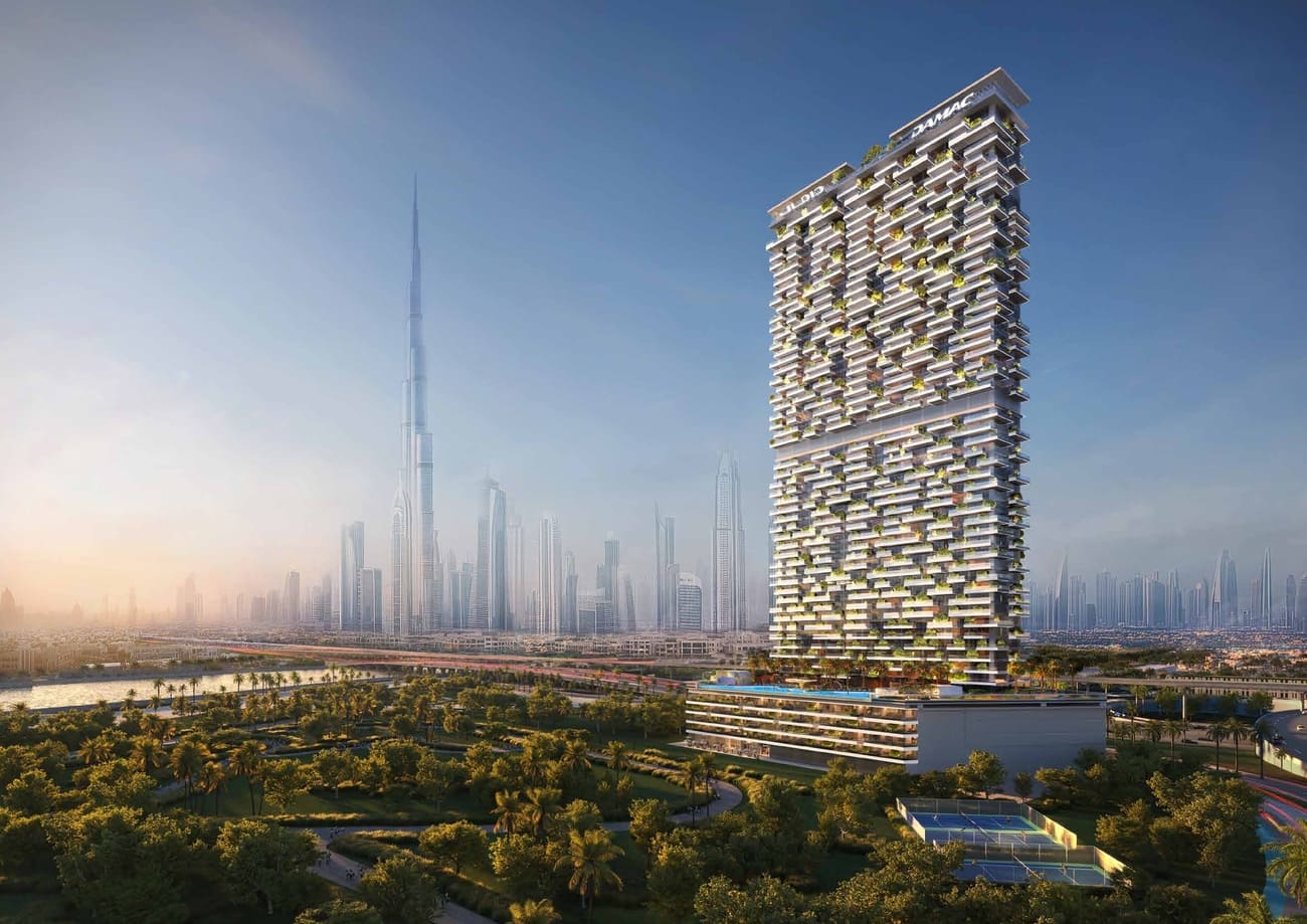 Tall luxury apartment building with greenery in an urban landscape
