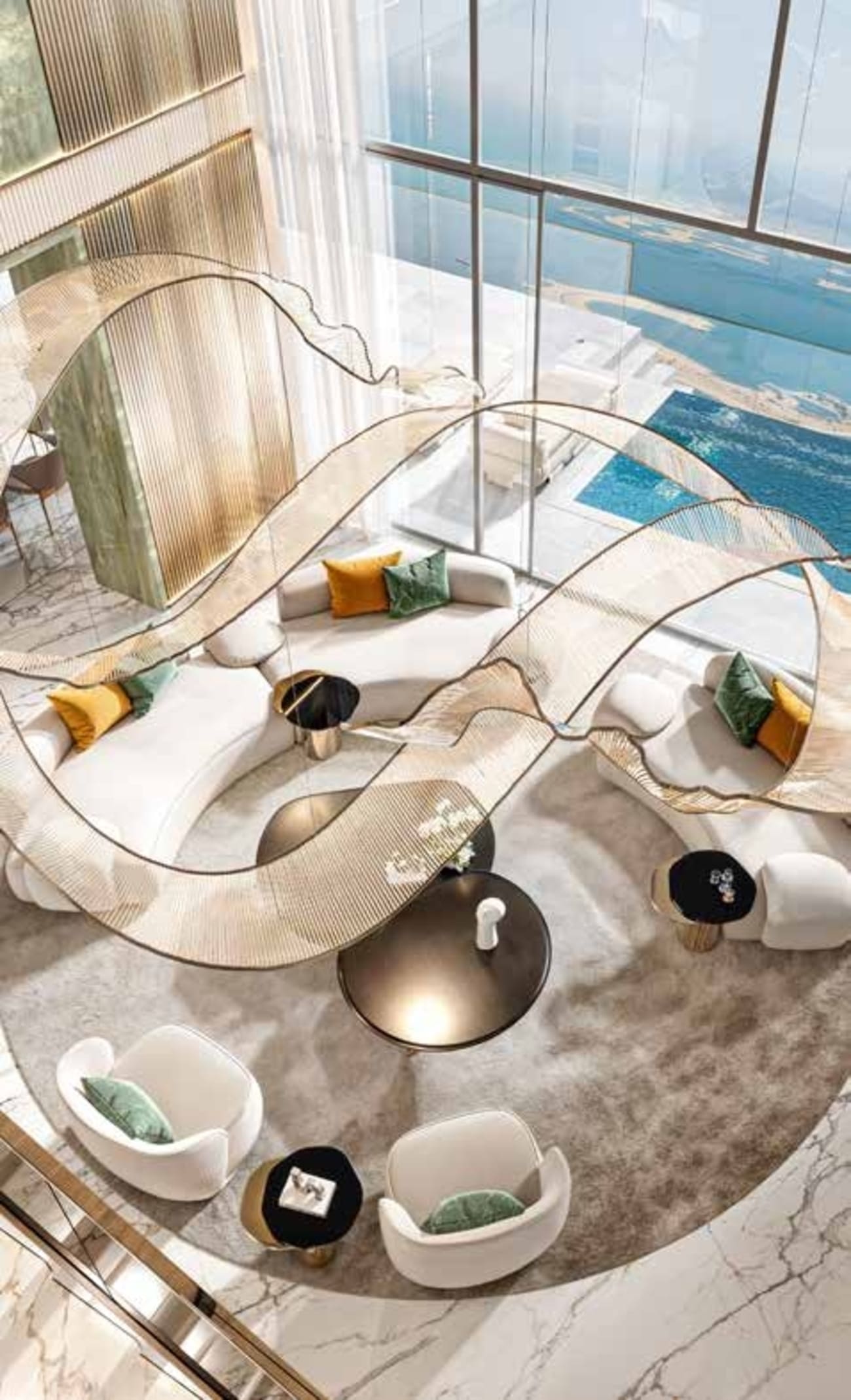 Modern living room with marble floor, glass coffee table, and large windows overlooking a pool.