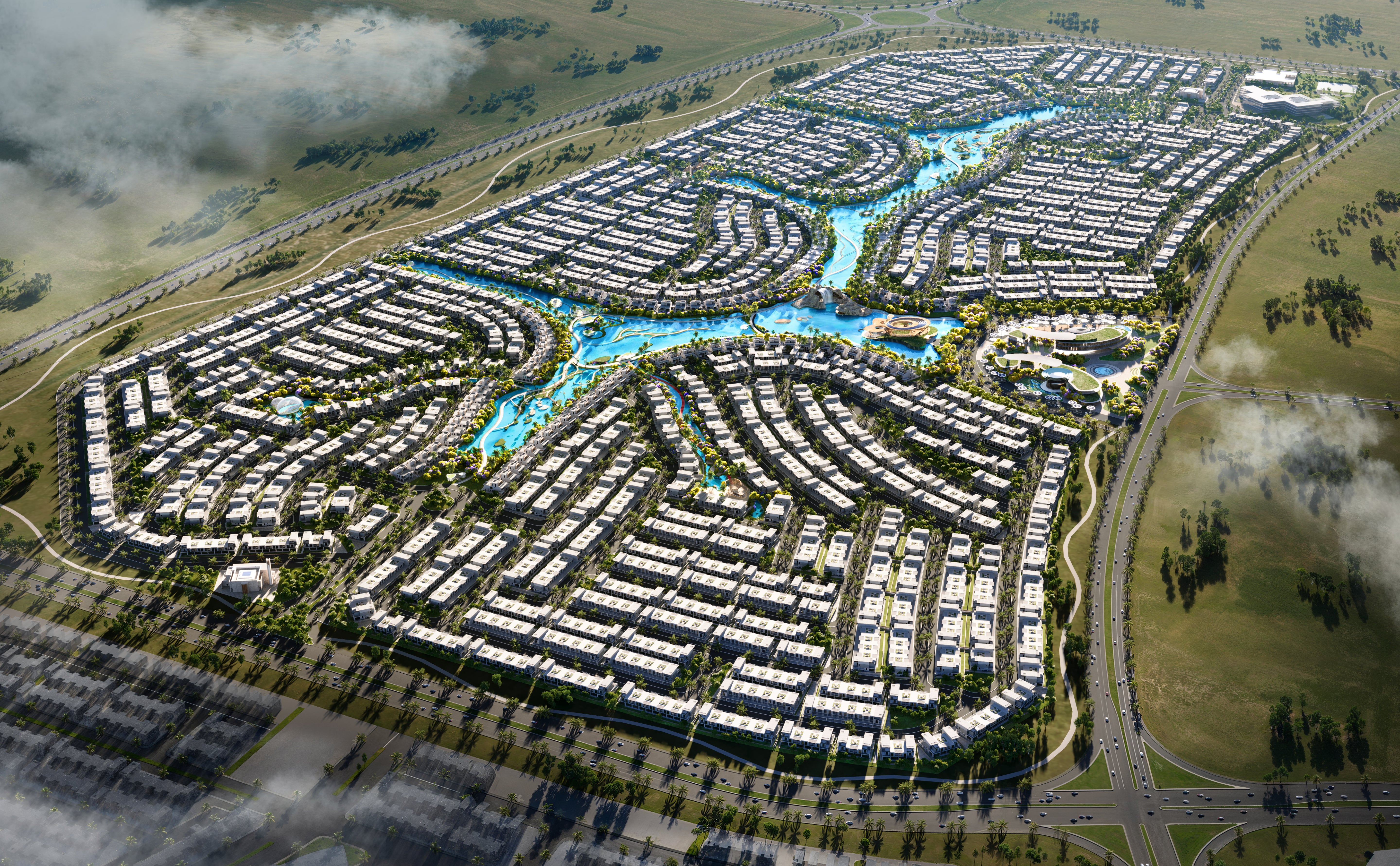 Aerial view of a planned residential area with houses and green spaces.
