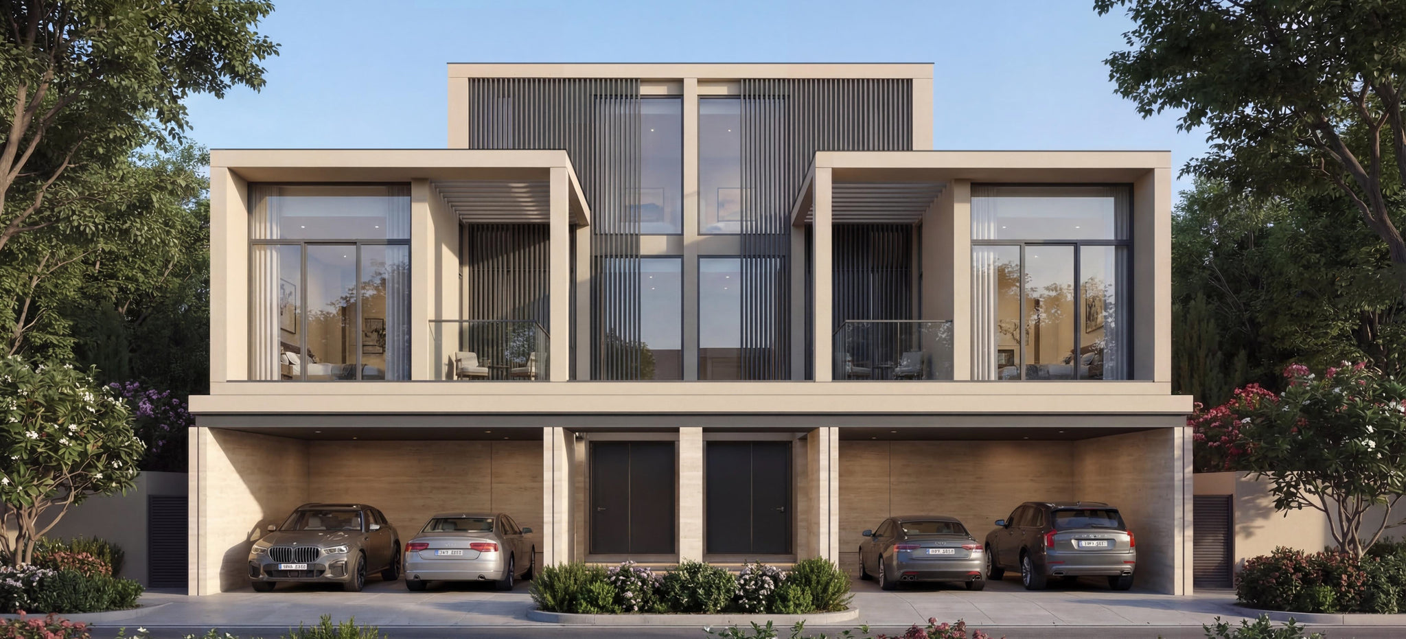 Modern twin villas with cars parked in a driveway